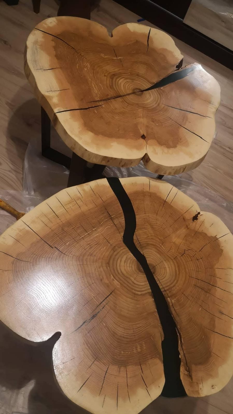 two black natural epoxy coffee table in the house